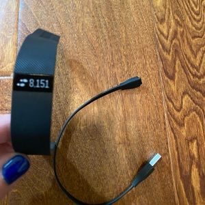 NWOT Older style Fit Bit with charger